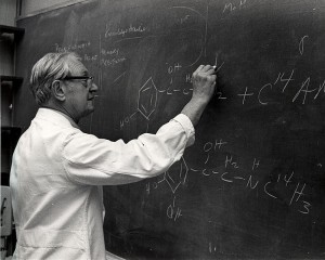 Dr. Julius Axelrod checking a student's work on the chemistry of catecholamine reactions in nerve cells.