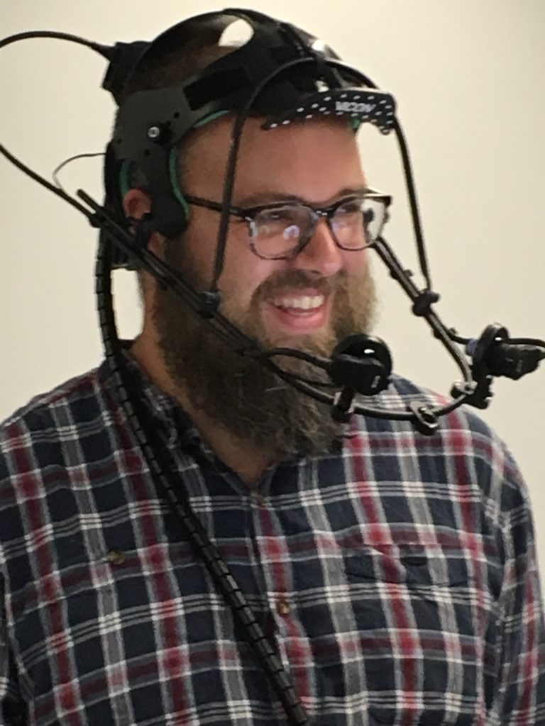 Dr Ben Oliver wearing motion capture helmet