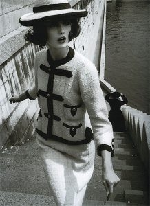 Photograph of Dorothy McGowan modelling Chanel in Paris, France, Vogue 1960, Photographer William Klein Accessed at https://www.balharbourshops.com/images/CultureWatch/ChanelToGo/the-sense-of-places-exhibition.jpg